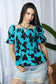 Bailey in Bold Peplum Top In Blue And Black